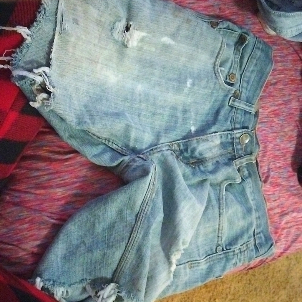 A pair of male ripped jean shorts